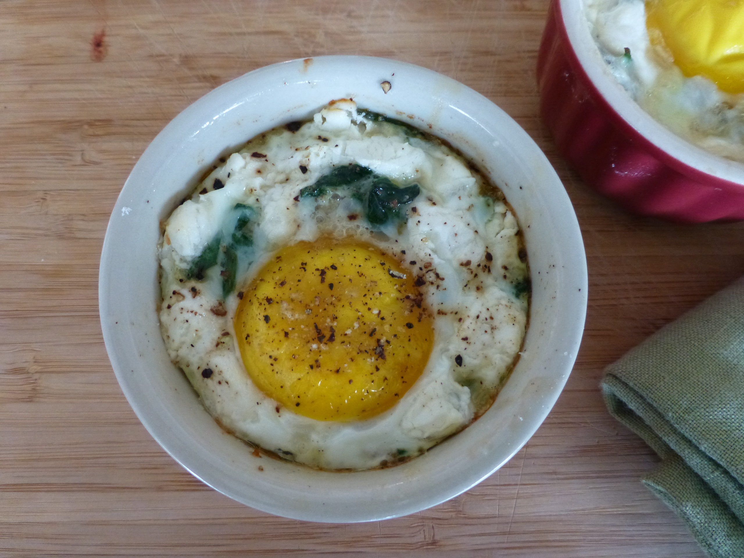 Baked Eggs with Goat Cheese, Garlicky Spinach and Mushrooms